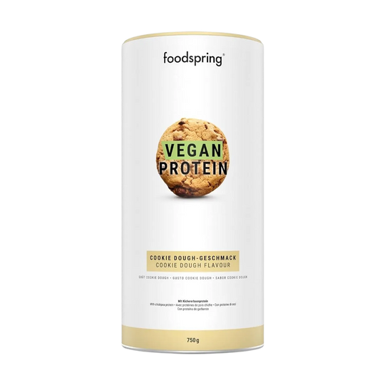 A 750g container of Foodspring Vegan Protein, a high-quality plant-based protein