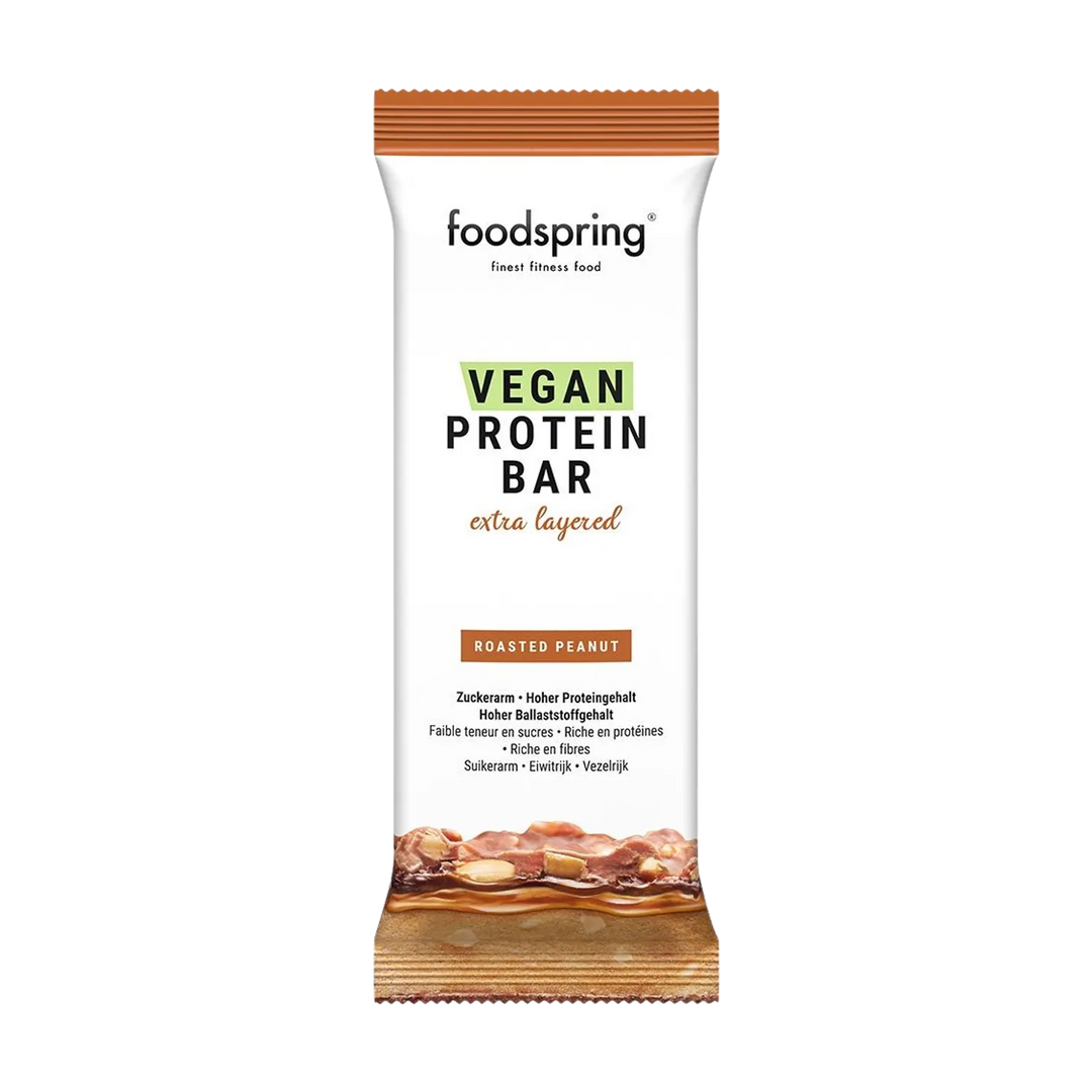 Indulge in the delectable Foodspring Vegan Protein Bar Extra Chocolate, a 45g guilt-free treat