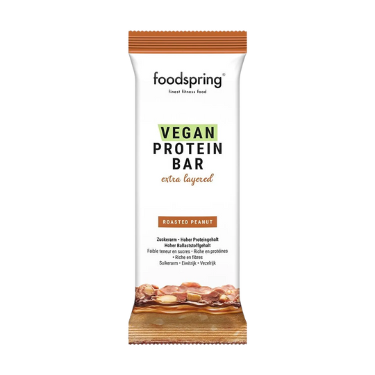 Indulge in the delectable Foodspring Vegan Protein Bar Extra Chocolate, a 45g guilt-free treat