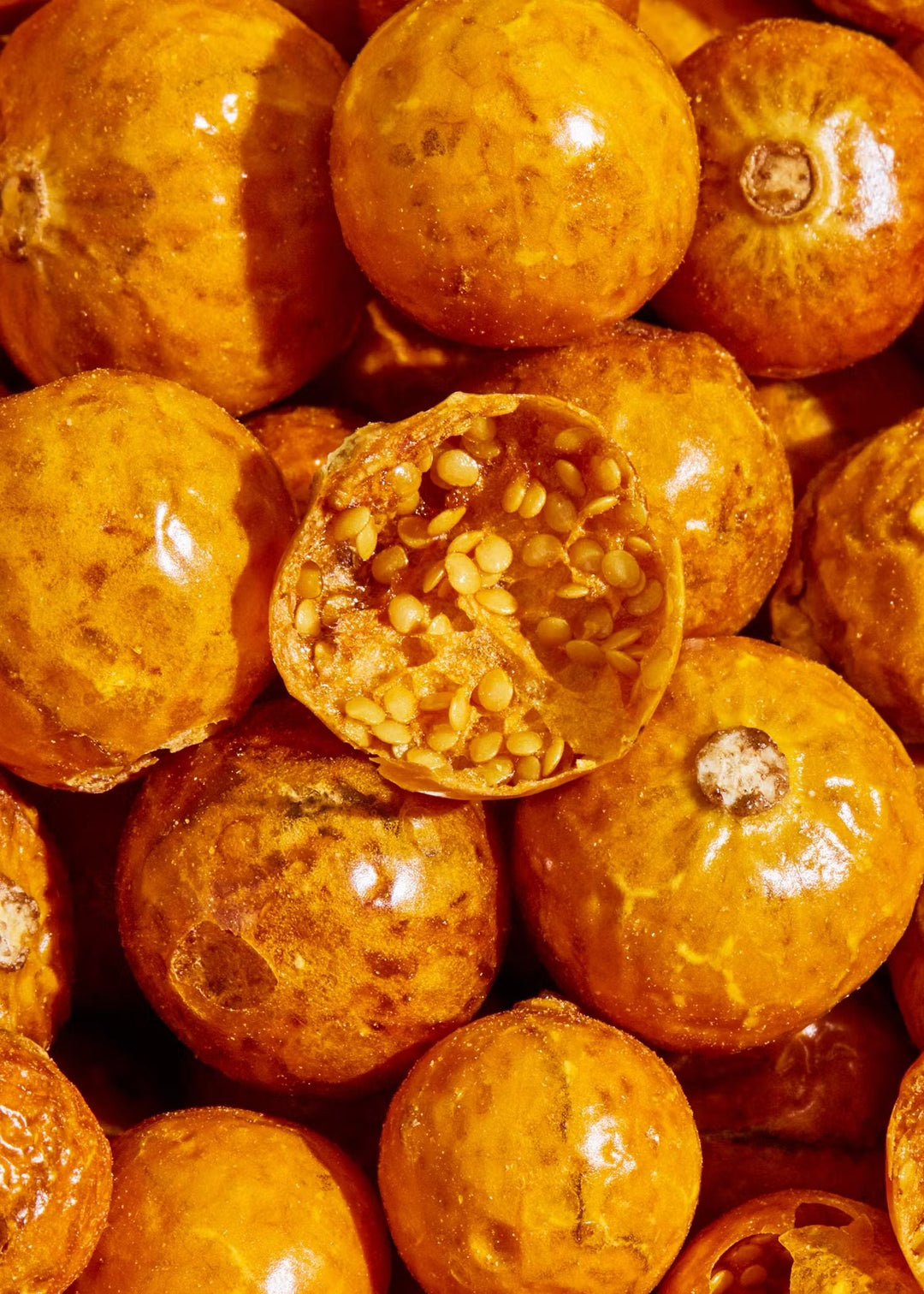 Organic physalis fruit coated in puffed rice for a crunchy snack