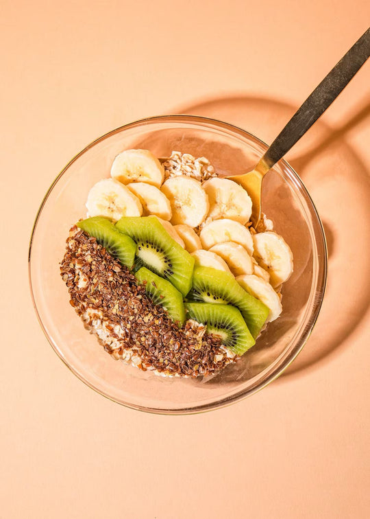 Close-up of freshly ground flaxseeds in a bowl with a spoon