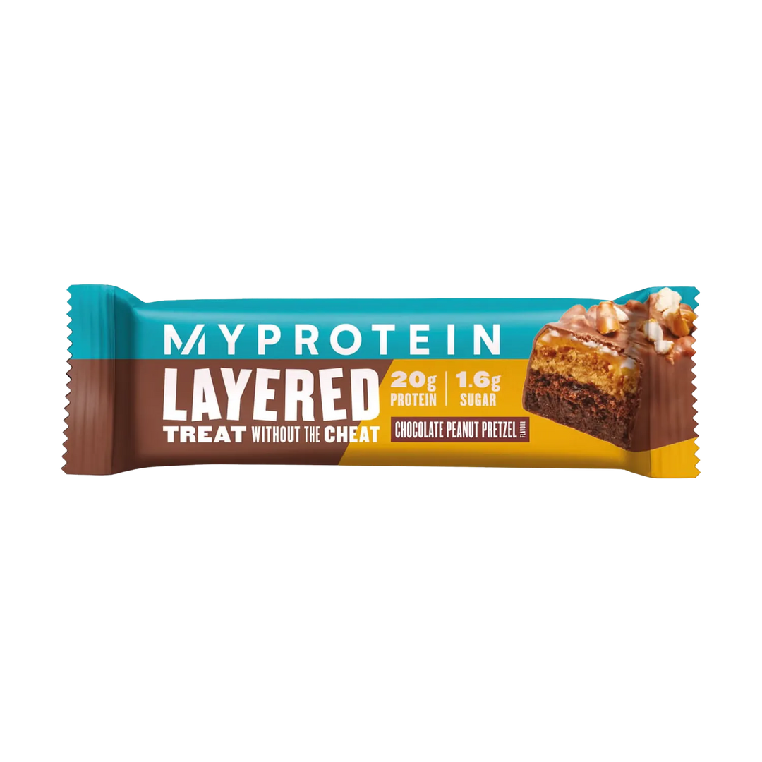 A close-up image of a 60g Myprotein Layered Bar in its packaging, showing the multiple layers of chocolate, caramel, and crispies