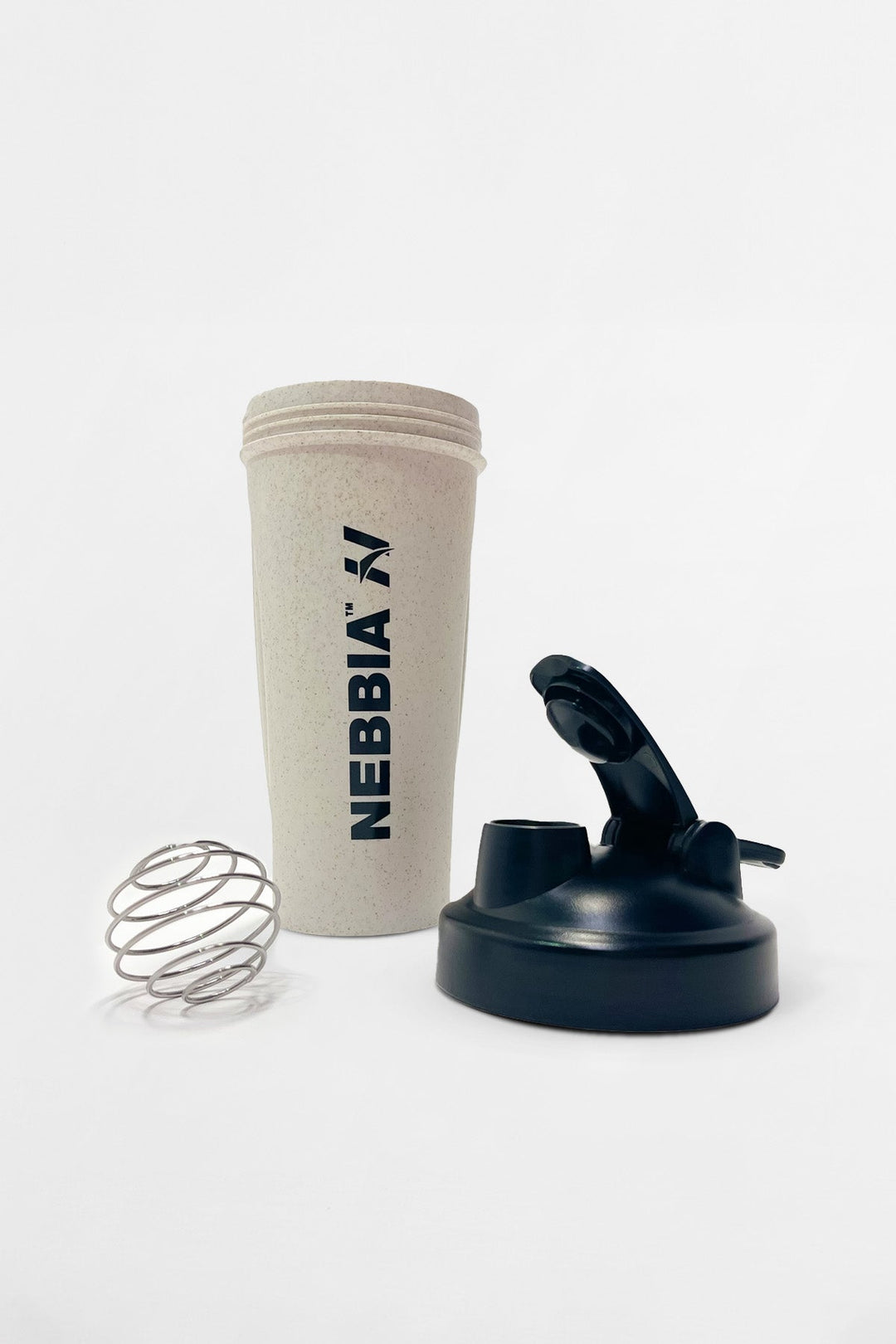 Transparent blender bottle with a black twist-on cap and built-in strainer